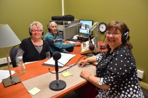 Elaine B. Holtz (L.) interviewing Julie Combs R.) with Ken Norton at the soundboard in Radio KBBF's new studio